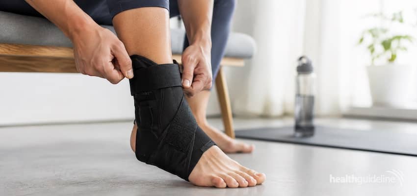 Aircast AirSport ankle brace being adjusted for secure ankle support, stability, and injury recovery during everyday activity.